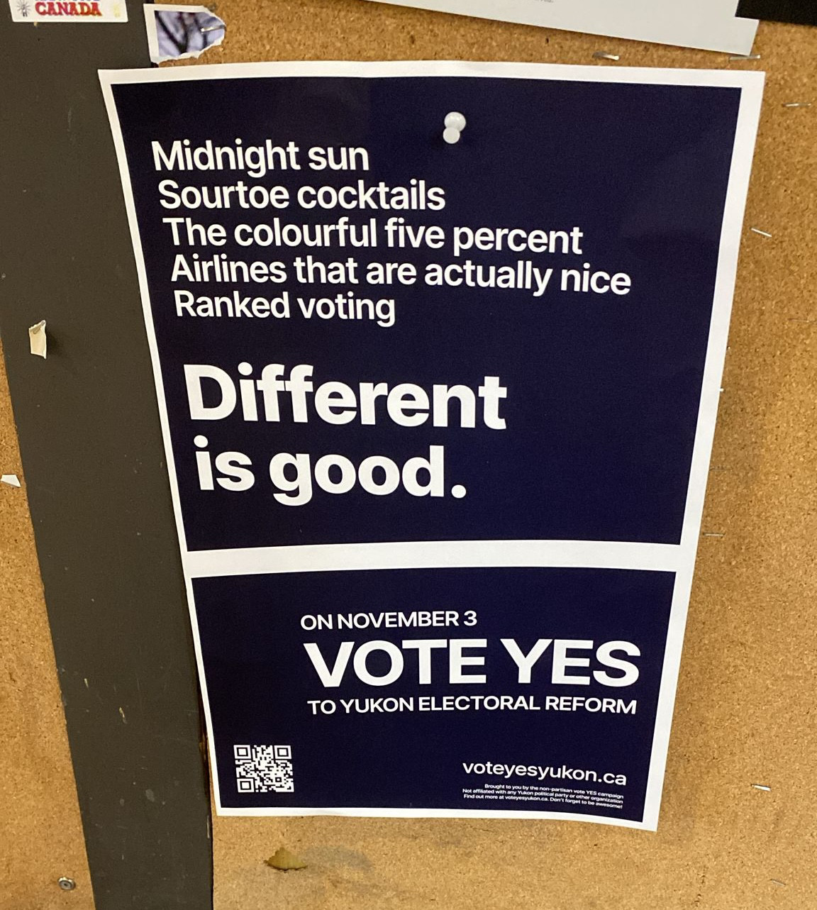 A “Different is good” poster up outside a Whitehorse coffee shop.