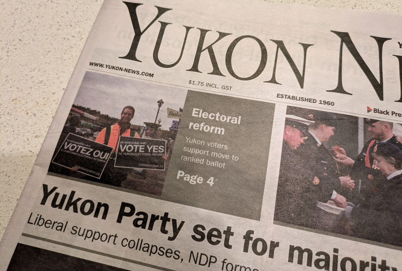 A photo of the print edition of the Yukon News, where Sean Boots and “Vote YES Yukon” are displayed on the cover with the successful plebiscite results.